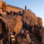 many-Tourists-looking-down-from-Mount-Sinai-at-sunrise-Egypt
