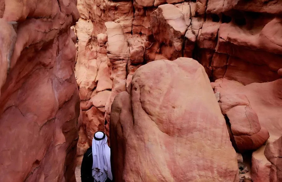 A-Bedouin-man-walks-through-Egypt’s-Coloured-Canyonin-the-Sinai-Peninsula