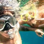 Adventurous-Friends-Taking-Selfie-Snorkeling-Underwater