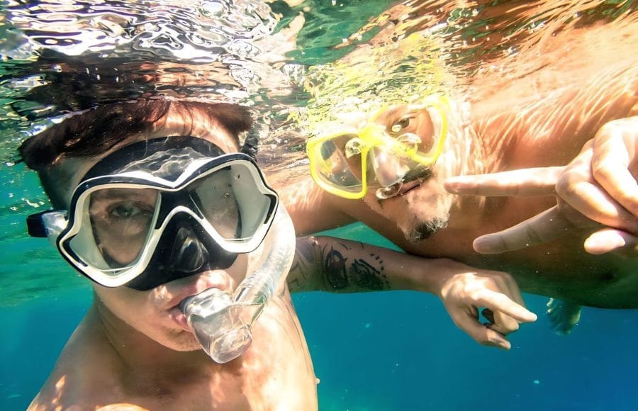 Adventurous-Friends-Taking-Selfie-Snorkeling-Underwater