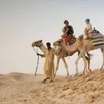 Bedouin-Leading-Two-Camels-Marsa-Alam-Desert