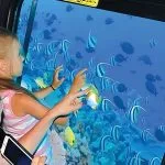 Girl-in-semi-submarine-boat-see-the-coral-reefs