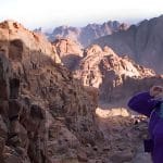 Japanese-woman-smiling-from-the-summi-of-Mount-Sinai