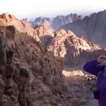 Japanese-woman-smiling-from-the-summi-of-Mount-Sinai