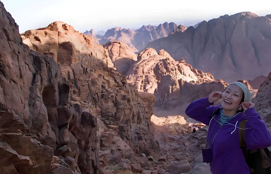 Japanese-woman-smiling-from-the-summi-of-Mount-Sinai