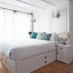 Cabin interior from the Lazuli Abydos Dahabiya Nile Cruise with white and blue Old English-style decor.