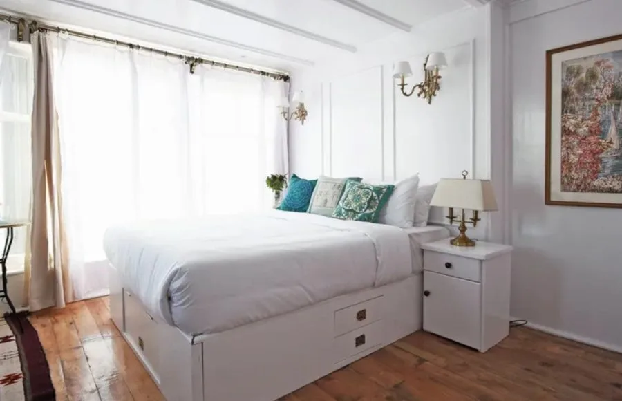 Cabin interior from the Lazuli Abydos Dahabiya Nile Cruise with white and blue Old English-style decor.