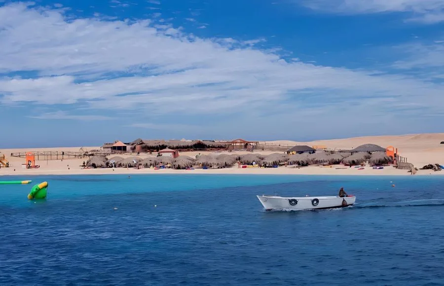 Mahmya-island-in-Red-Sea-blue-water-sky-with-clouds-and-boats