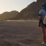 Portrait-Of-Lonely-Woman-Watching-Beautiful-Sunset In-The-Mountains-In-Sharm-El-Sheikh