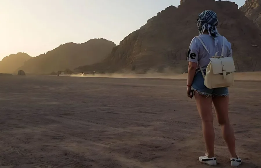 Portrait-Of-Lonely-Woman-Watching-Beautiful-Sunset In-The-Mountains-In-Sharm-El-Sheikh