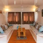 Interior cabin view of the Three Pyramids Dahabiya Nile Cruise boat.