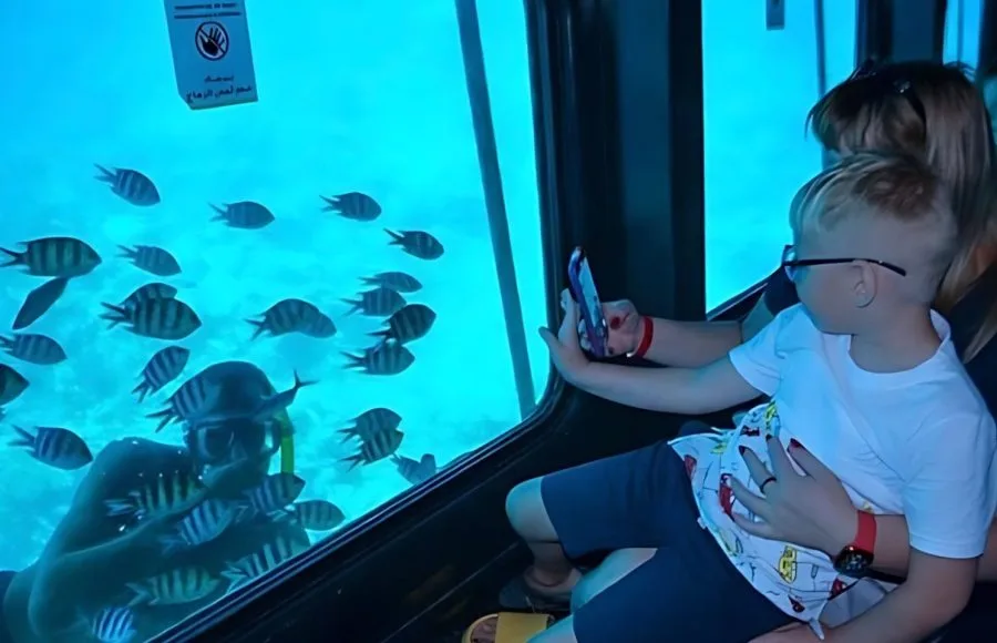 Tourist-taking-photo-to-man-snorkeling-semi-submarine-in-sharm-el-sheikh