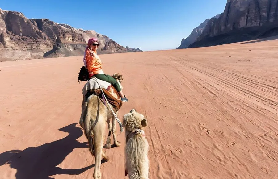 Tourist-woman-in-traditional-arabian-clothes-with-camel-in-Sharm-el-Sheikh