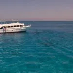 Tourists-Boat-Anchored-In-Bay-In-Hamata-Island-For-Snorkeling
