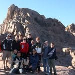 Western-tour-group-people-in-early-morning-after-sunrise-climb-walk-on-Mount-Sinai