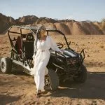 Woman-Tourist-On-Quad-Bike-Safari-With-Desert
