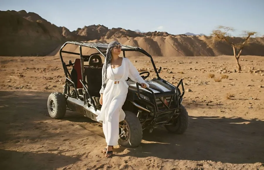 Woman-Tourist-On-Quad-Bike-Safari-With-Desert