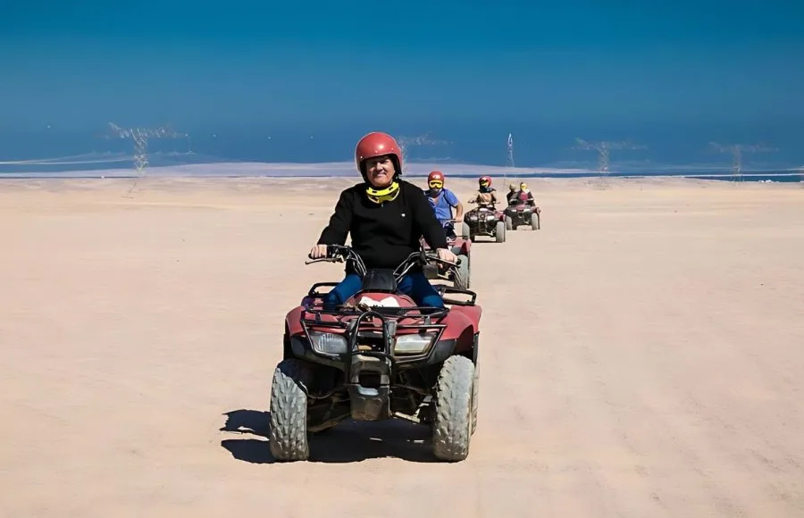 Tourists-In-Safari-Trip-Through-Makadi-Bay-Desert-Driving-Quad-Bike