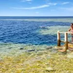 Woman-on-the-platform-going-down-to-the-Blue-Hole-Dahab