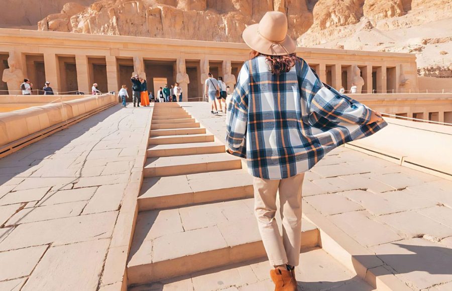 Tourist ascending the steps of the Temple of Hatshepsut a highlight of the 3 Day Upper Egypt Short Break Tour