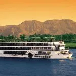 A ship sailing on the Nile River, central to the 7 day Cairo Alexandria tour with Nile cruise.