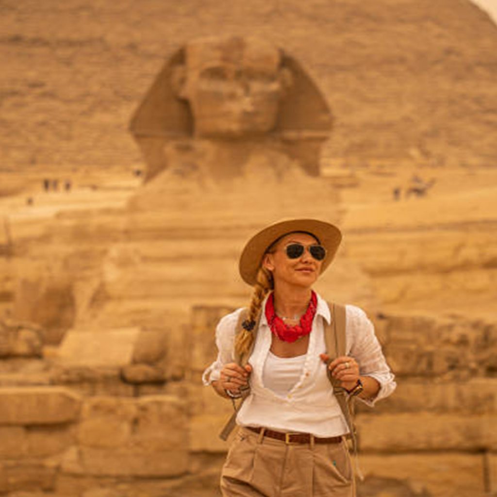 Female traveller standing before the Great Sphinx of Giza on a 6 day Egypt tour package.