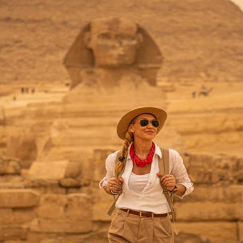 Female traveller standing before the Great Sphinx of Giza on a 6 day Egypt tour package.