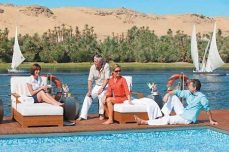 Seniors Relaxing By A Pool On A Nile Cruise Ship Deck During A 9 Day Senior Egypt Tour With Nile Cruise.