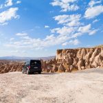 A-car-parked-with-views-of-Devrent-Valley-Cappadocia