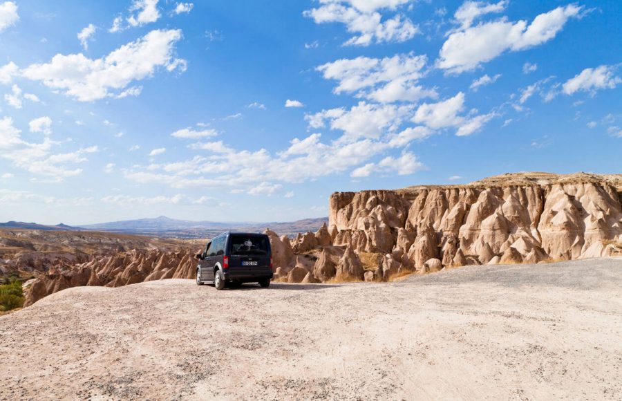 A-car-parked-with-views-of-Devrent-Valley-Cappadocia