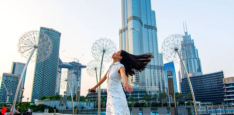 A Girl Having A Walk In Front Of Dubai Mall Fountain At The Day Time