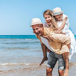 A happy family at hurghada beach during their 15 day Egypt Morocco Hurghada and Sahara tour