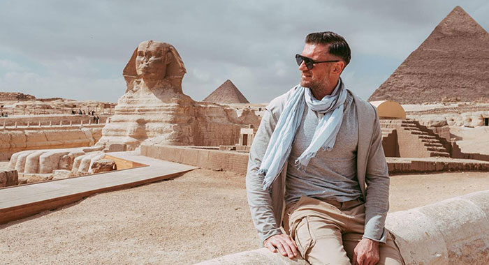 A Man Against The Background Of The Giza Pyramids