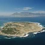Aerial-View-of-Robben-Island-with-Table-Mountain-and-Cape-Town