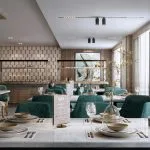 Luxurious, two-story cruise ship atrium with curved seating, glass railings, and a large chandelier.