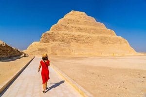 A woman walking towards the Saqqara Step Pyramid on a shore excursion from Alexandria, Egypt