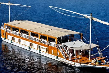 High-angle view of a traditional twin-masted Dahabiya sailing boat on the blue Nile.