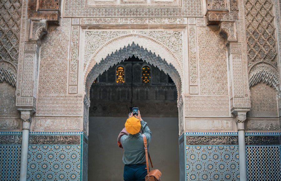 An-Asian-Chinese-female-tourist-photographing-and-admiring-Fez-Mosque-Bou-Inania-Madressa
