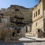 Ancient-rock-cut-cave-houses-and-millstones-in-Avanos-Cappadocia-Turkey