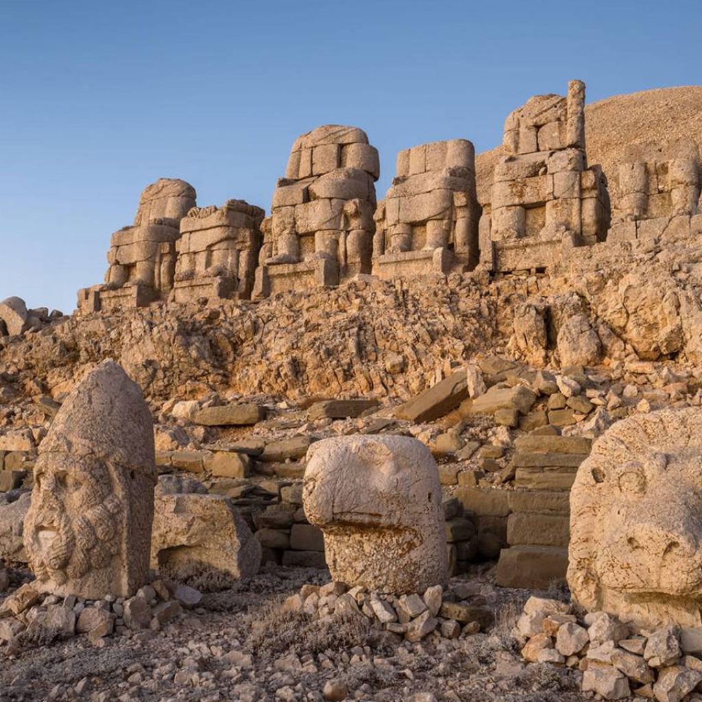 Antique statues on Nemrut mountain at Adiyaman inTurkey