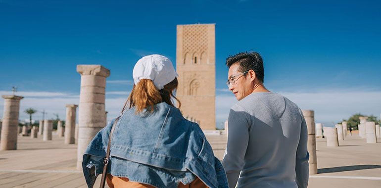 Asian Chinese female tourist exploring at Hassan Tower Rabat Morocco