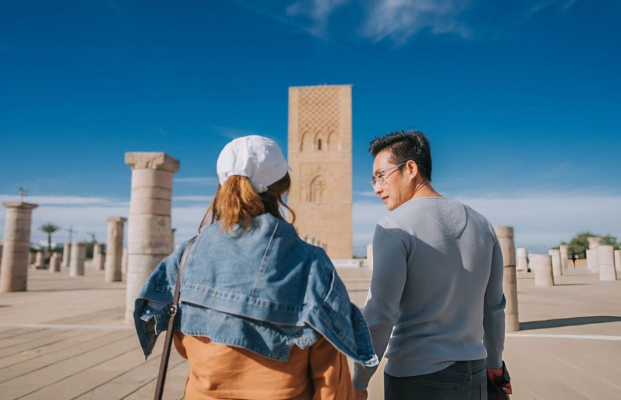 Asian-Chinese-female-tourist-exploring-at-the-Hassan-Tower-Rabat-Morocco