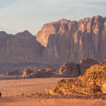Bedouin-man-walking-across-desert-Wadi-Rum-Jordan