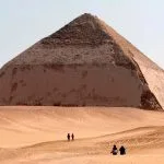 A wide shot of travelers exploring the desert during a professional Bent Pyramid tour in Dahshur