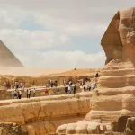 The majestic Sphinx guards the Cairo pyramids as part of an unforgettable Cairo and Aswan Tour