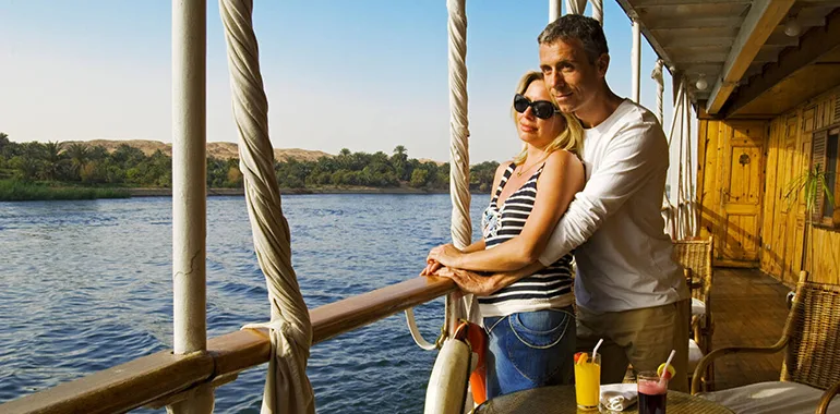 Couple Enjoying Sunset On A Nile Cruise During The Best Travel Season.