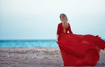 Tourist walking on a Red Sea beach, the perfect Egypt 12 day tour finale.