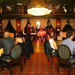 A live band performing traditional music for guests on a Nile cruise with a belly dancer and folk music