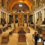 The grand hall of the Egyptian Museum showcasing ancient statues during a Cairo layover itinerary with museum visit