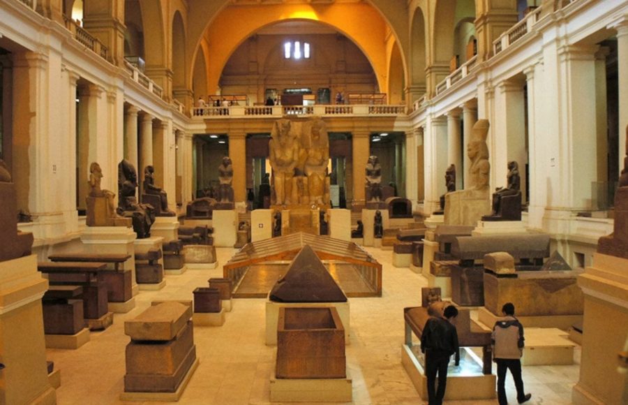 The grand hall of the Egyptian Museum showcasing ancient statues during a Cairo layover itinerary with museum visit